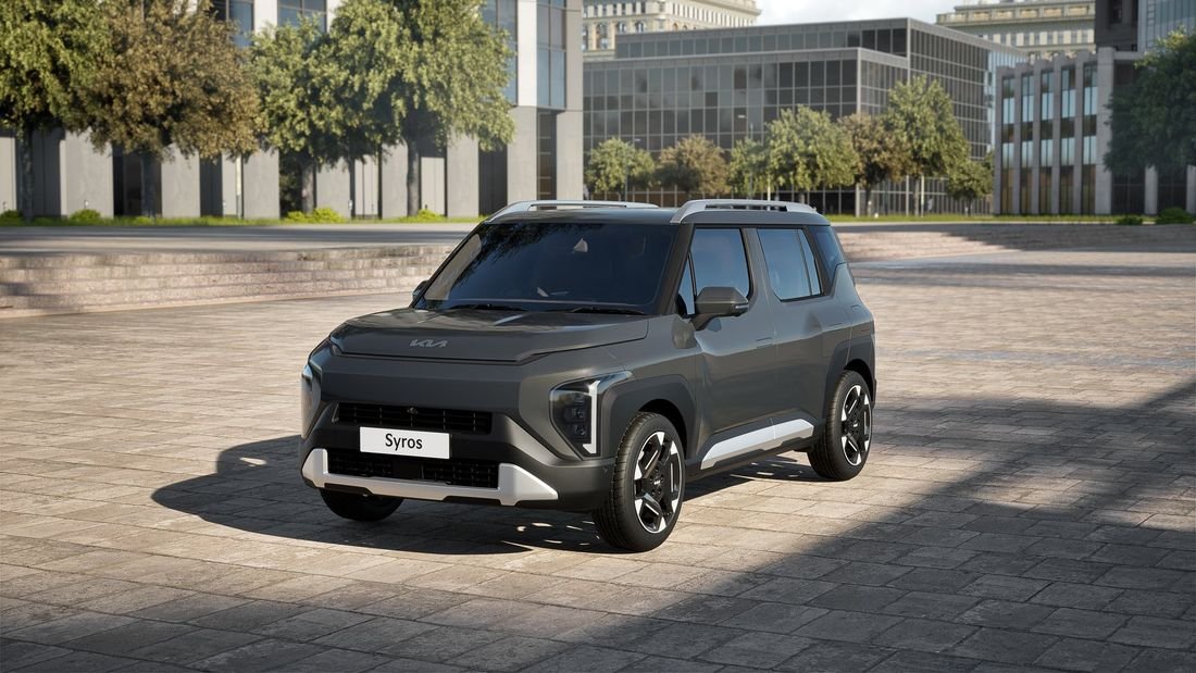Kia Syros EV parked in an urban plaza